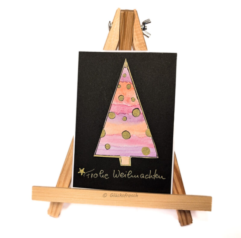 Weihnachtskartemit handgezeichnetemrosa Weihnachtsbaum auf schwarzem Hintergrund